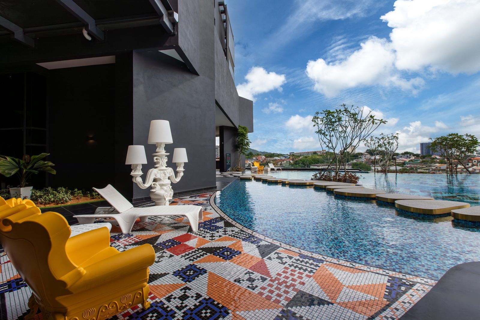 Rooftop pool deck at Arte Cheras with the Cheras skyline in the background