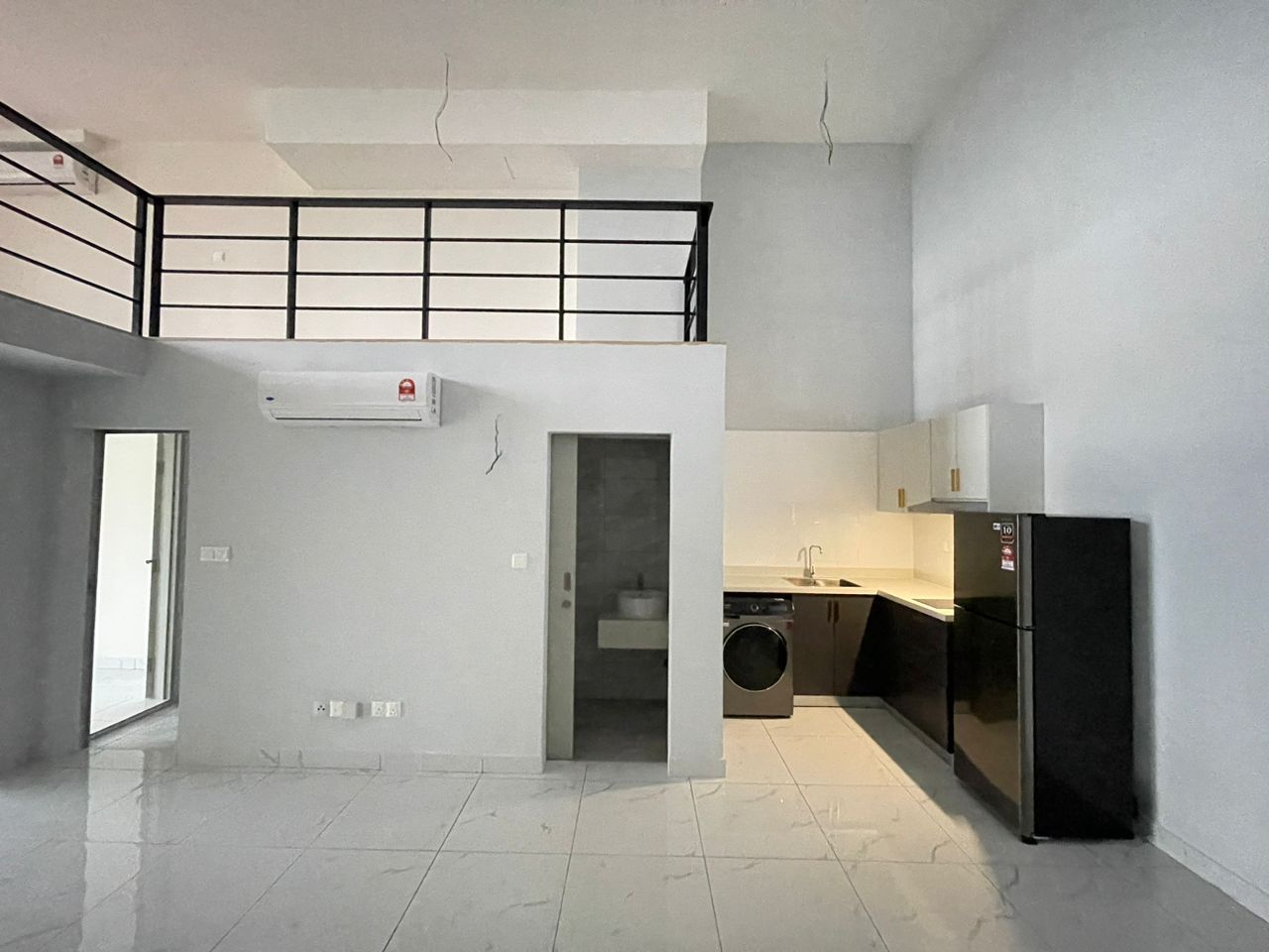 Kitchen area of the unit, with fitted cabinetry