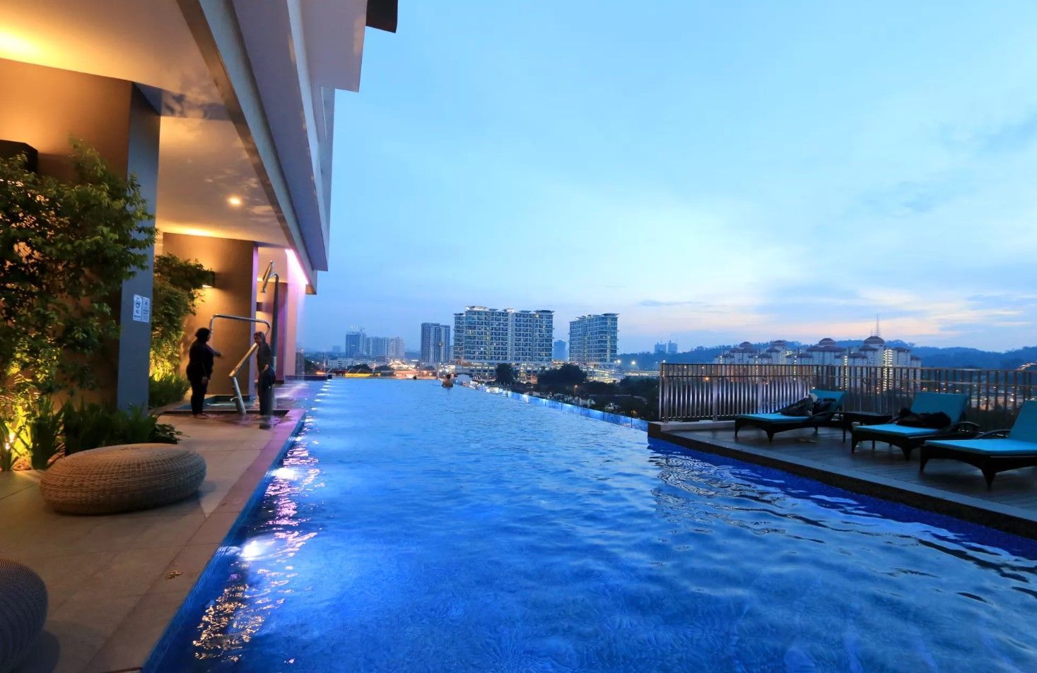 Infinity pool at dusk at Avantas Residences, with the KL skyline in view