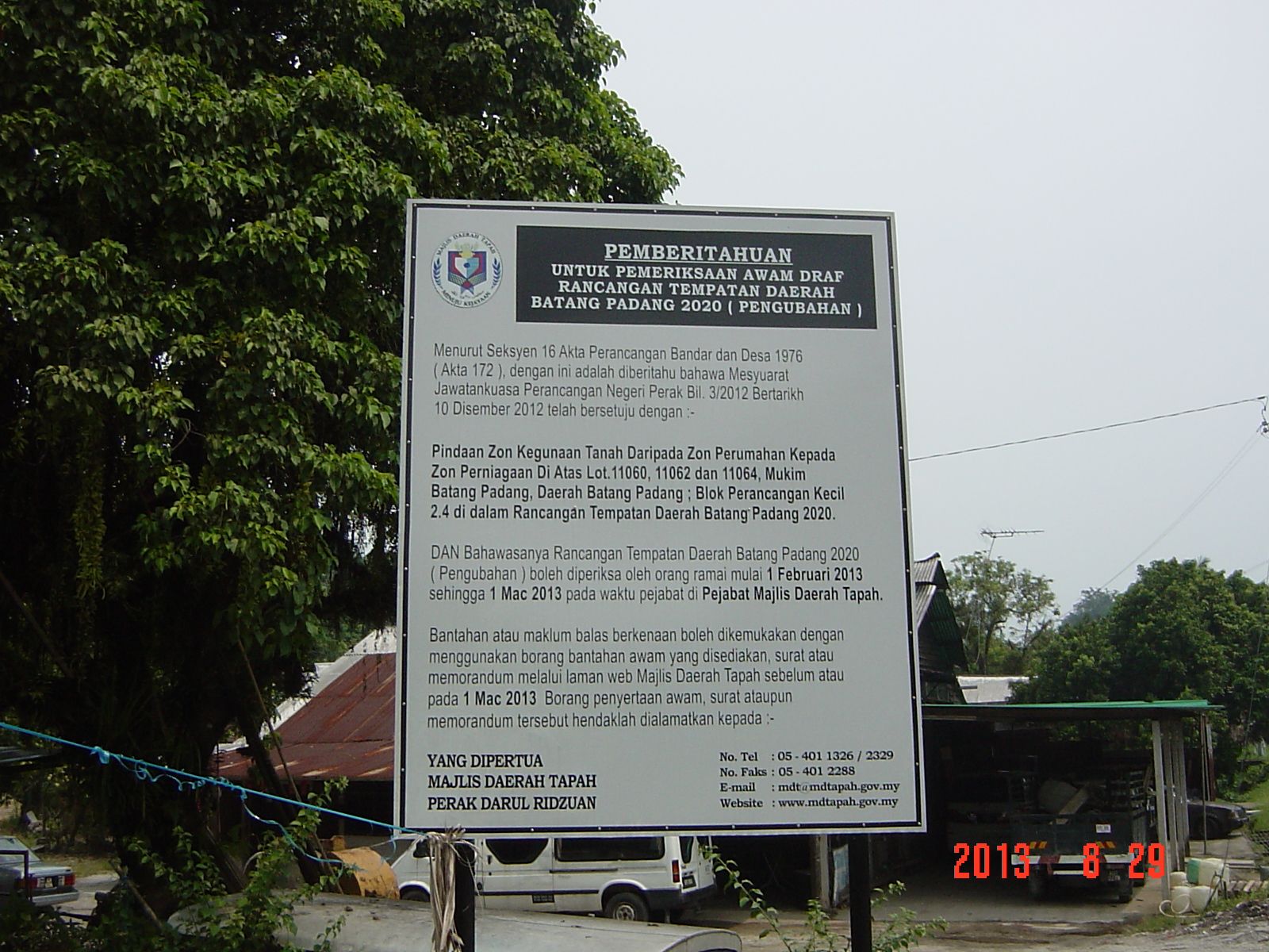 Official Majlis Daerah Tapah public notice board confirming the rezoning of this parcel from residential to commercial zone
