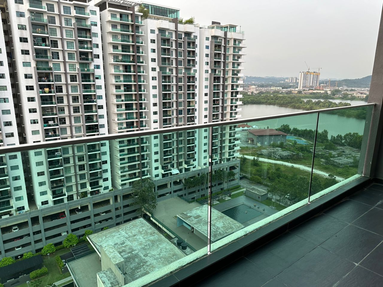 Panoramic view from the unit's balcony, facing the facilities and surrounding Puchong skyline